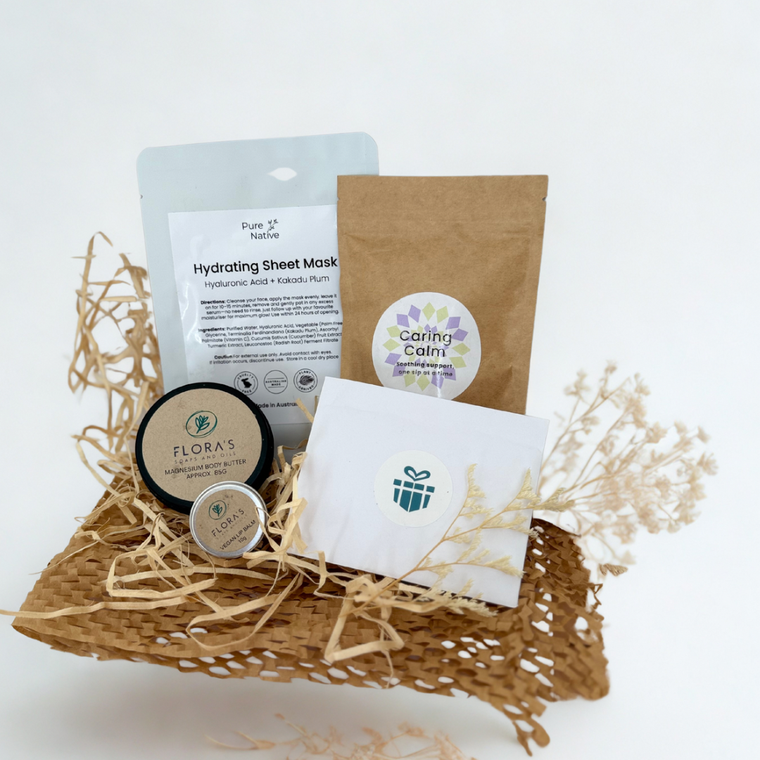 Products that make up the Australian cancer care box including vegan lip balm and organic herbal tea